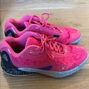 Kawhi New Balance pink and grey basketball shoes.